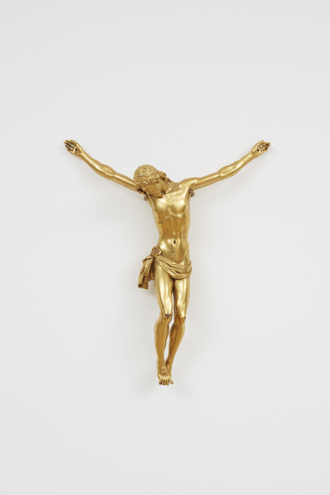 Statue of an entirely gold colored crucified Christ