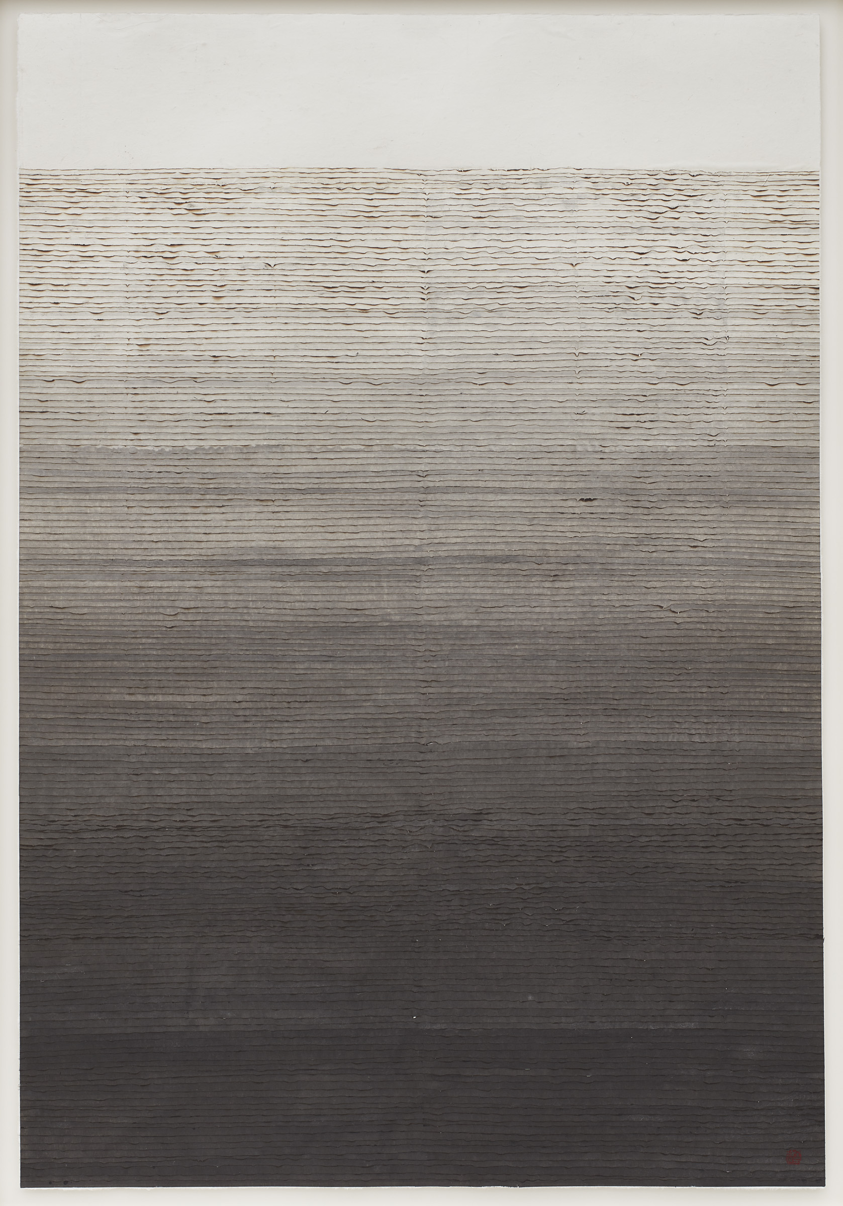 Lines of burnt p aper arranged horizontally from lightest at the top to darkest at the bottom.