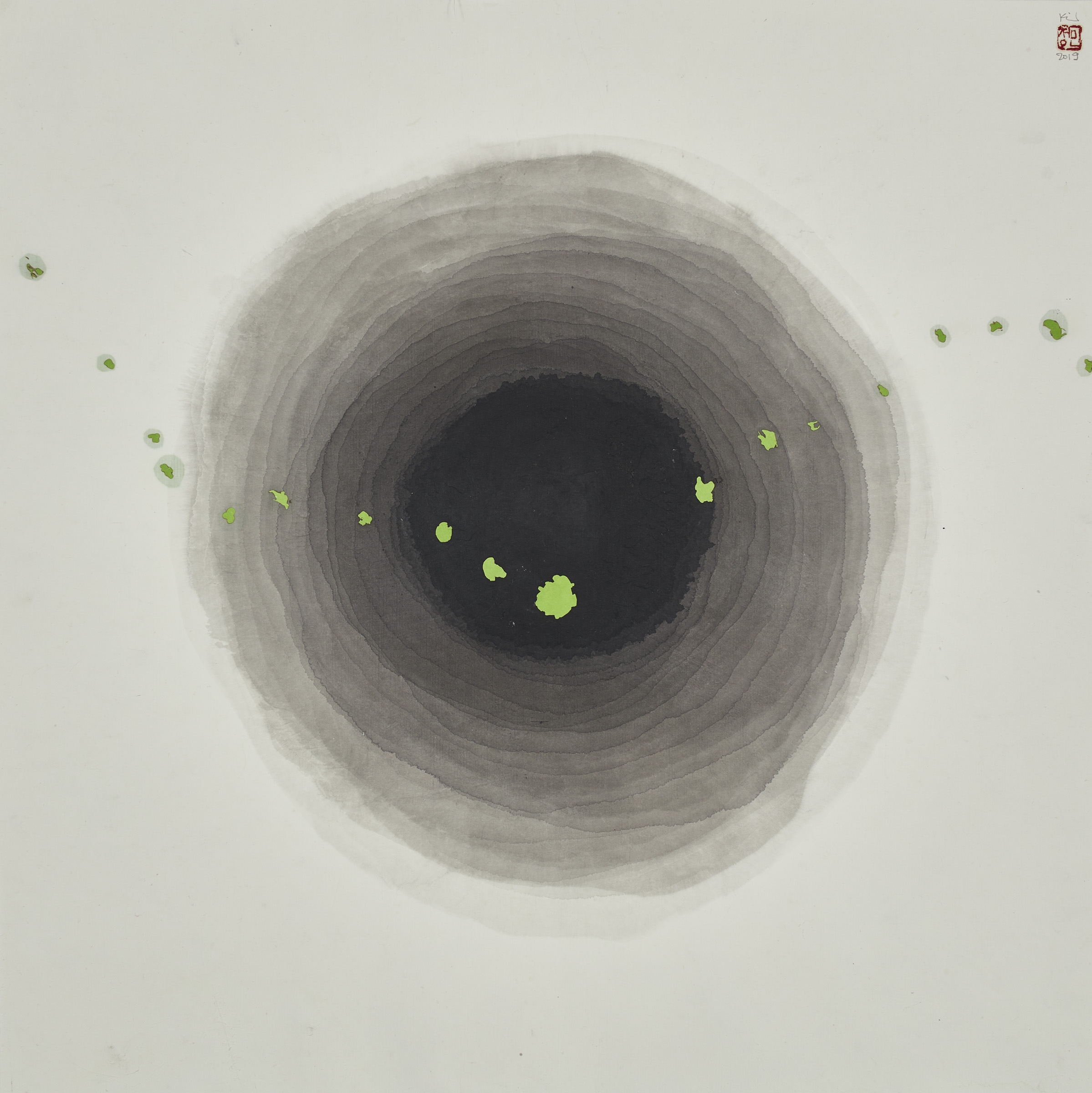 Ink circles that become darker and darker as they move towards the center of a page with a series of green ink dots stretching horizontally across the work.