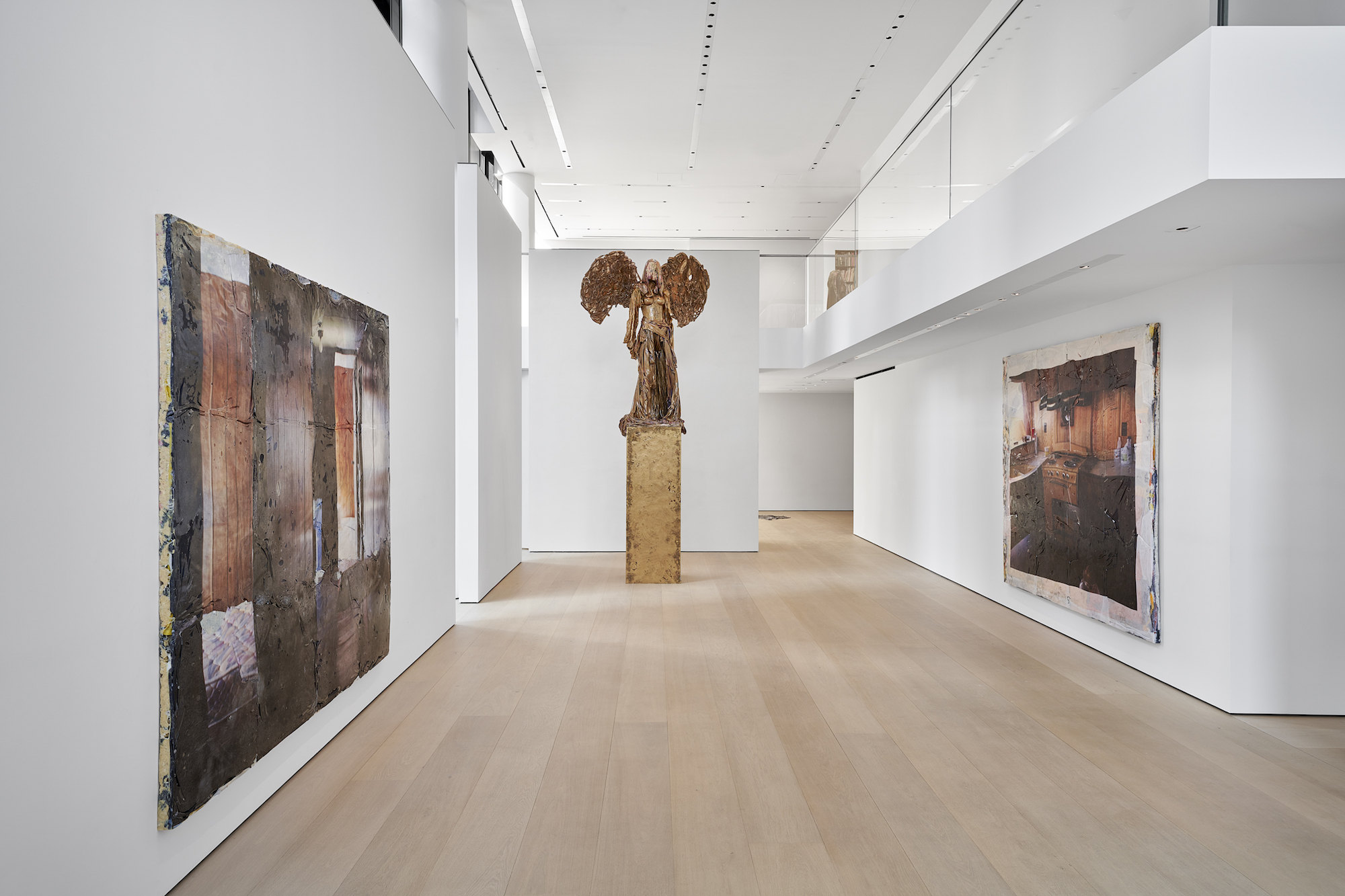 Installation view with two paintings and a sculpture